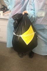 More than 200 COVID-19 swabs taken from St Basil's residents and staff were placed in a garbage bag and transported by taxi to the lab.