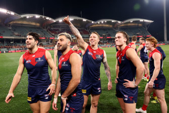 The Demons celebrate their win over Brisbane.