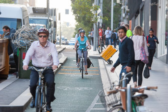Cyclists using a bike lane in La Trobe St.