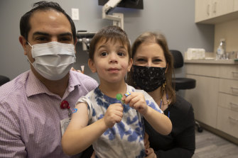 Vaccines will be available to children as young as three-year-old Hudson, seen here with his parents Barry and Ilena Diener at a vaccine trial in New York last November. 