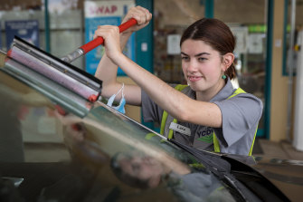Staff member Lara Johnson working at the petrol station. 