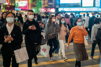 Pedestrians wear face masks in Hong Kong amid the coronavirus outbreak. 
