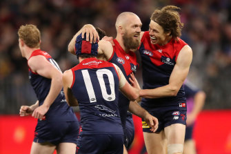 Ben Brown is all smiles with Max Gawn and teammates.
