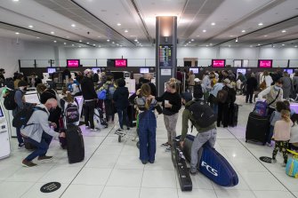 Passengers at Melbourne Airport Terminal 3. A Virgin Australia flight attendant who has since tested positive had been on various flights around Australia.