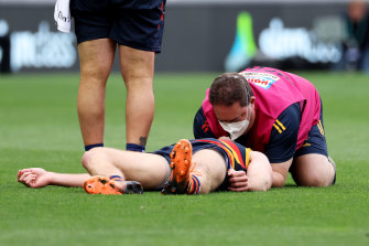 A medic attends to Brodie Smith. 