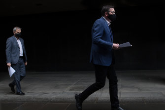 Premier Daniel Andrews leads Chief Health Officer Brett Sutton into the daily briefing.