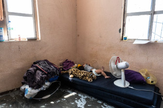 A small child sleeps in squalid conditions at the El Buen Pastor shelter for migrants in Ciudad Juarez, Mexico.