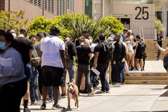 People stand in long lines to receive the monkeypox vaccine at San Francisco General Hospital this week.