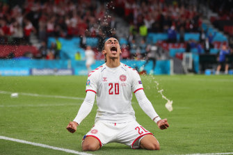 Yussuf Poulsen celebrates Denmark’s second goal.