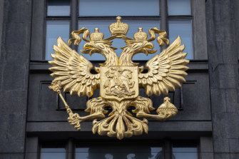 The coat of arms of the Russian Federation on the front of the State Duma building in Moscow.