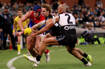 Angus Brayshaw is tackled by Sam Powell-Pepper.