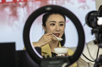 Livestreamer Huang Wei, known professionally as Viya, prepares to sample a bowl of food. 
