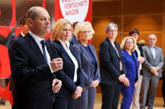 Incoming German chancellor Olaf Scholz, left, with part of his cabinet including: Nancy Faeser, interior minister, Christine Lambrecht, defence minister and Klara Geywitz, construction minister, in Berlin on Monday.