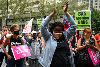 A demonstrator claps during a Planned Parenthood Day of Action Rally in Brooklyn, New York, on September 9, 2021, held in response to new laws restricting abortions in Texas. 