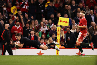 Beauden Barrett of New Zealand scores his sideâ€™s sixth try.