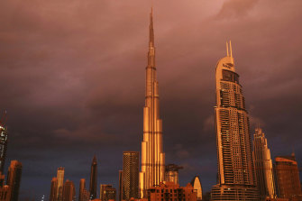 Sunlight reflects off the Burj Khalifa, the worldâ€™s tallest building, during a rain shower in Dubai in 2018.  