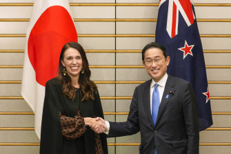 Jacinda Ardern, New Zealand’s prime minister, left, and Fumio Kishida, Japan’s prime minister, shake hands during a bilateral meeting in Tokyo on Thursday.