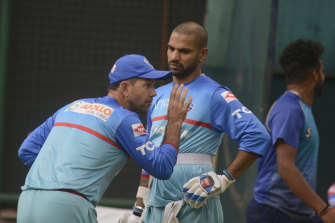 Ricky Ponting conveys his wisdom to Shikhar Dhawan in his role as Delhi Capitals coach in the IPL.