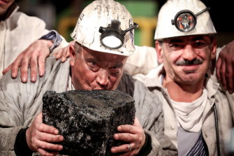 Germany is one place turning its back on coal: Miners kiss the last piece of coal during a farewell event for the German hard coal mining industry in 2018.