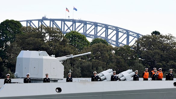 Chinese Navy personnel on board a Chinese warship that arrived at Garden Island Naval Base on Monday.