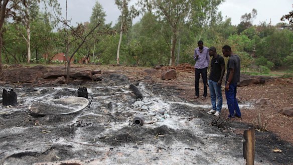 Attacks by extremists are not uncommon in Mali. In this picture from June 2017, locals survey the burned Campement Kangaba after an Islamic extremist attack near Bamako. 