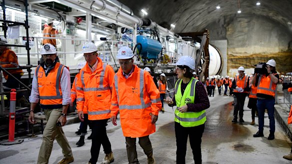Transport Minister Andrew Constance, third from left, and Premier Gladys Berejiklian inspect the boring machine at Barangaroo.