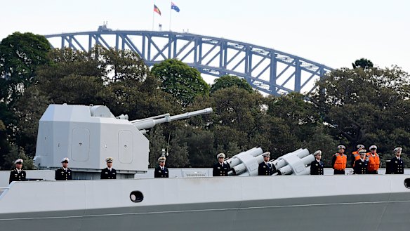 Chinese Navy personnel are seen on board a Chinese warship that arrived at Garden Island Naval Base in Sydney on Monday.