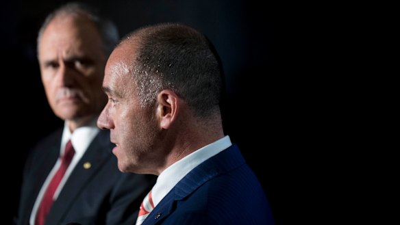 Succumbed to pressure from shareholders and the NAB board: Chairman Ken Henry and CEO Andrew Thorburn.