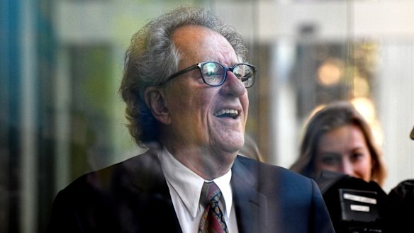 Geoffrey Rush leaves court on Monday afternoon.