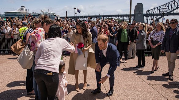 The Duke and Duchess, Harry and Meghan meet the crowd outside the Sydney Opera House.