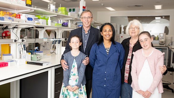 Cancer researcher Professor Sudha Rao (centre) at the Melanie Swan Memorial Translational Centre with Melanie's parents David and Carol Swan, and daughters Sophie (8) and Emma (11) Chamberlain.
