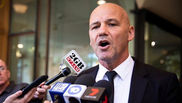 Gary Jubelin speaks to the media outside the Downing Centre Courts on Friday. 