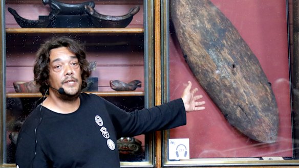 Rodney Kelly speaks in front of the Gweagal Shield at the British Museum.