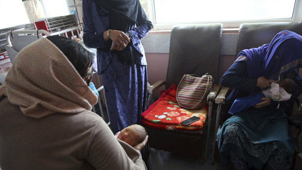 A mother, right, breastfeeds her two-day-old baby at the Ataturk Children's Hospital, a day after they were rescued from a deadly attack on the MSF maternity hospital in Kabul, Afghanistan.