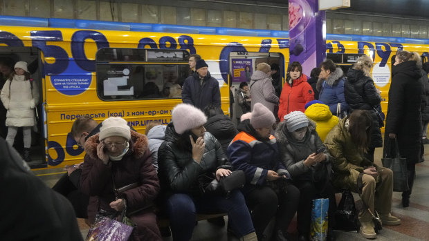 People rest in the subway station, being used as a bomb shelter during a rocket attack in Kyiv, Ukraine on Friday, December 16. 