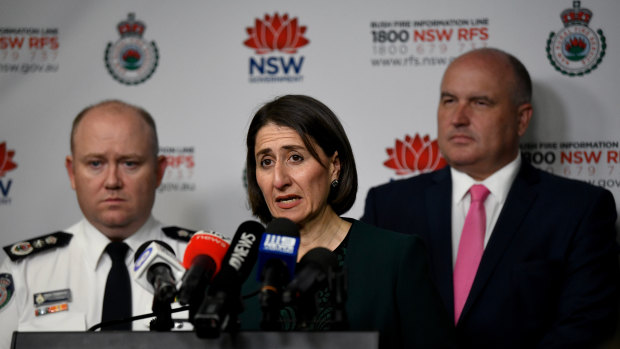 RFS Commissioner Shane Fitzsimmons, Premier Gladys Berejiklian, and Minister for Police and Emergency Services David Elliott, right.