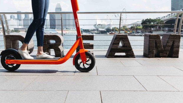 Neuron Mobility's bright orange scooters are contracted to be on Brisbane streets.