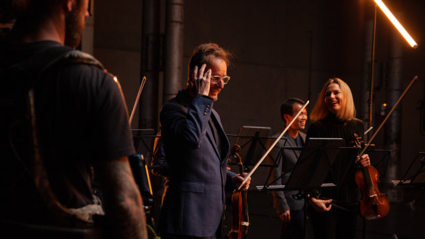 Richard Tognetti and principal violin Satu Vanska during a filming of an ACO StudioCast at Sydney's Carriageworks.