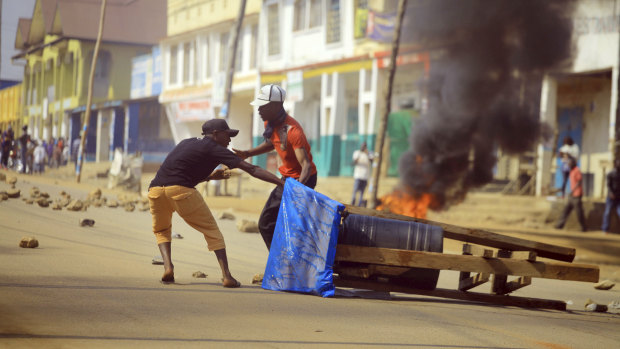 Protesters set up a barricade in the Eastern Congolese town of Beni on Thursday after elections were delayed.
