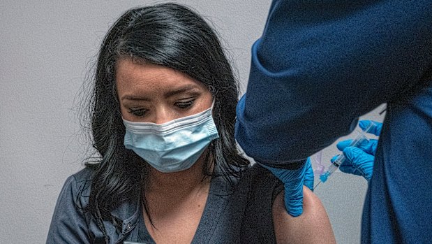 Focusing on employers: Healthcare worker and new employee Amber Blunk gets her first vaccination at Nashville General Hospital.