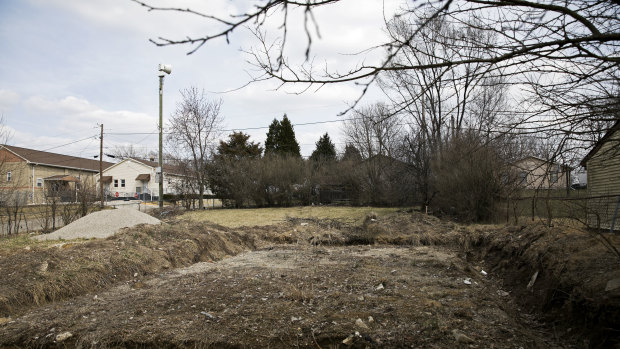 An empty lot in Indianapolis that was sold to an investor. A home was supposed to be built there, but never was. 