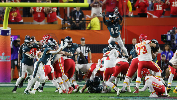 The Chiefs’ Harrison Butker kicks the Super Bowl-winning field goal with eight seconds left.