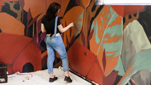 Ash Taylor was one of 25 artists who redecorated the building on Mary Street that has been unused until the owners allowed artists to use it as a hub.