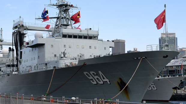 The Australian and Chinese flags are seen on board a Chinese warship after it arrived at Garden Island Naval Base in Sydney on Monday.