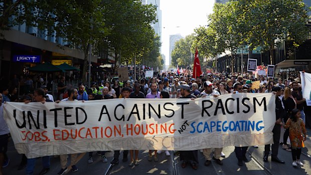 Demonstrators are seen during an anti-racist and anti-fascist rally in Melbourne.