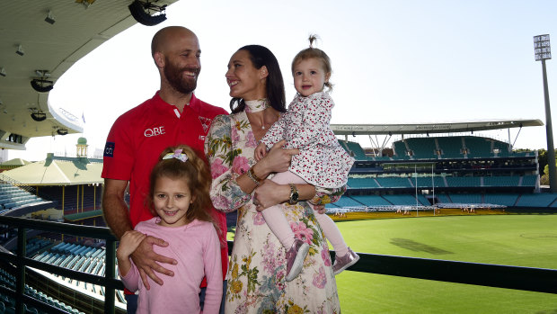 Jarrad McVeigh with his wife Clementine and daughters Lolita-Luella (left) and Florence (right) after announcing his retirement on Thursday.