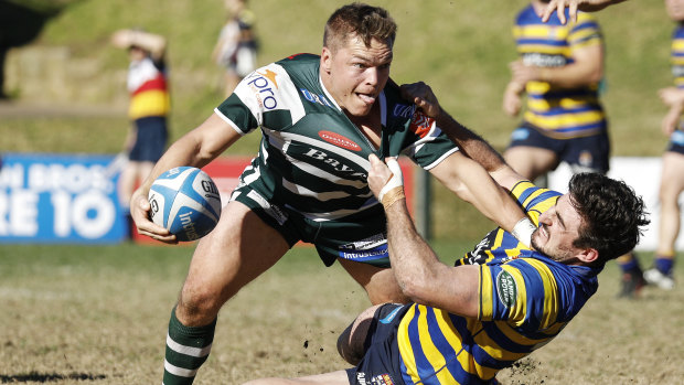 Sydney University's Henry Clunies-Ross makes a tackle in his return to rugby against Warringah.