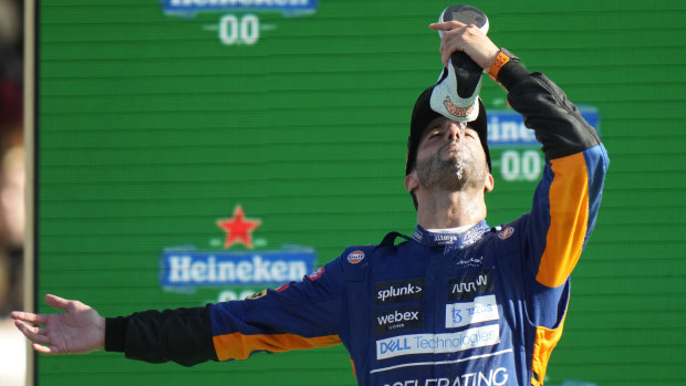 Daniel Ricciardo celebrates his victory in trademark style at Monza in Italy.