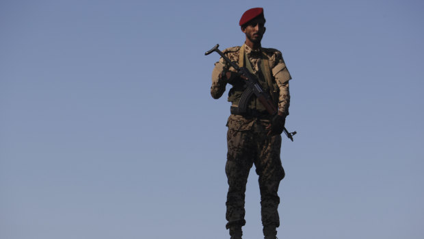A soldier allied to Yemen's internationally recognised government stands guard at the port of Aden.