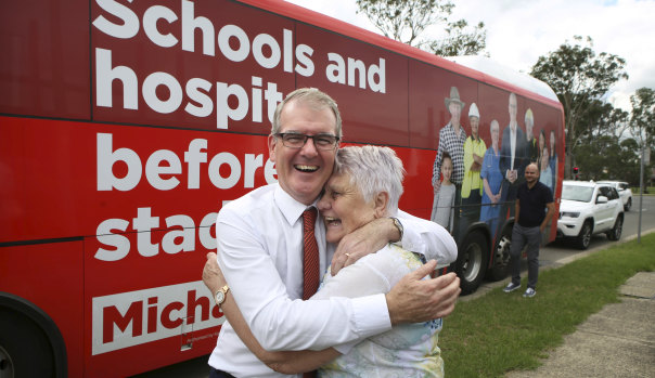 Opposition Leader Michael Daley gets a hug from swinging voter Louise Hollier of  St Clair.